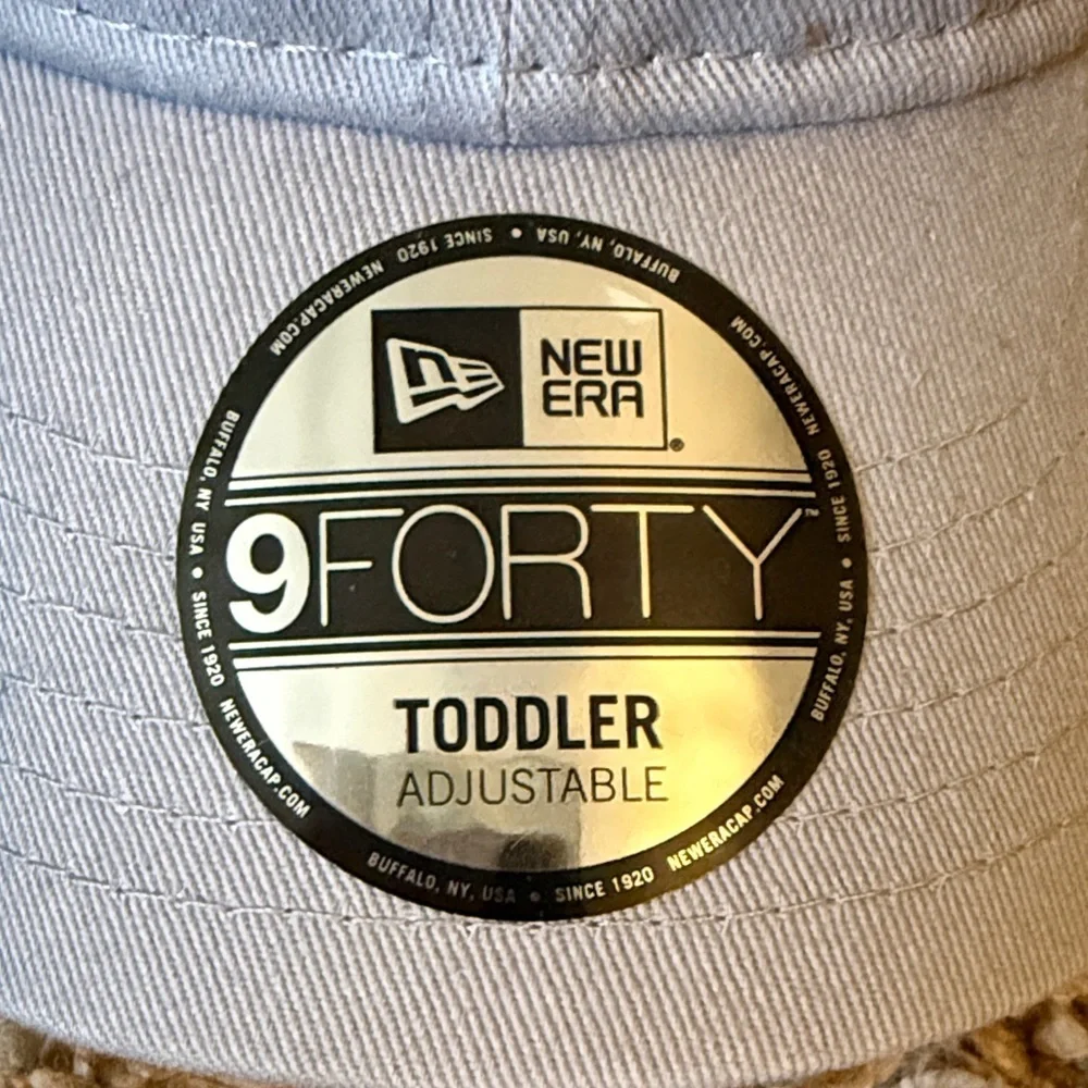 New Era Beige Cap with Unicorn Embroidery purchased at Yankee Stadium